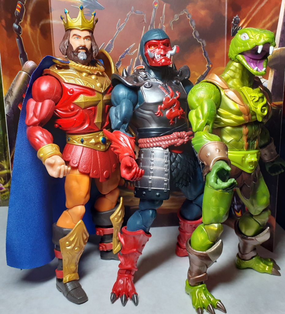 Some figures from the New Eternia sub-line that were release in 2025. From the left there's King Randor with red armour and blue cape, Ninjor in black and red armour and Kobra Khan, a snake man covered in shiny green scales. The figures are posed as though have just done a dance routine.