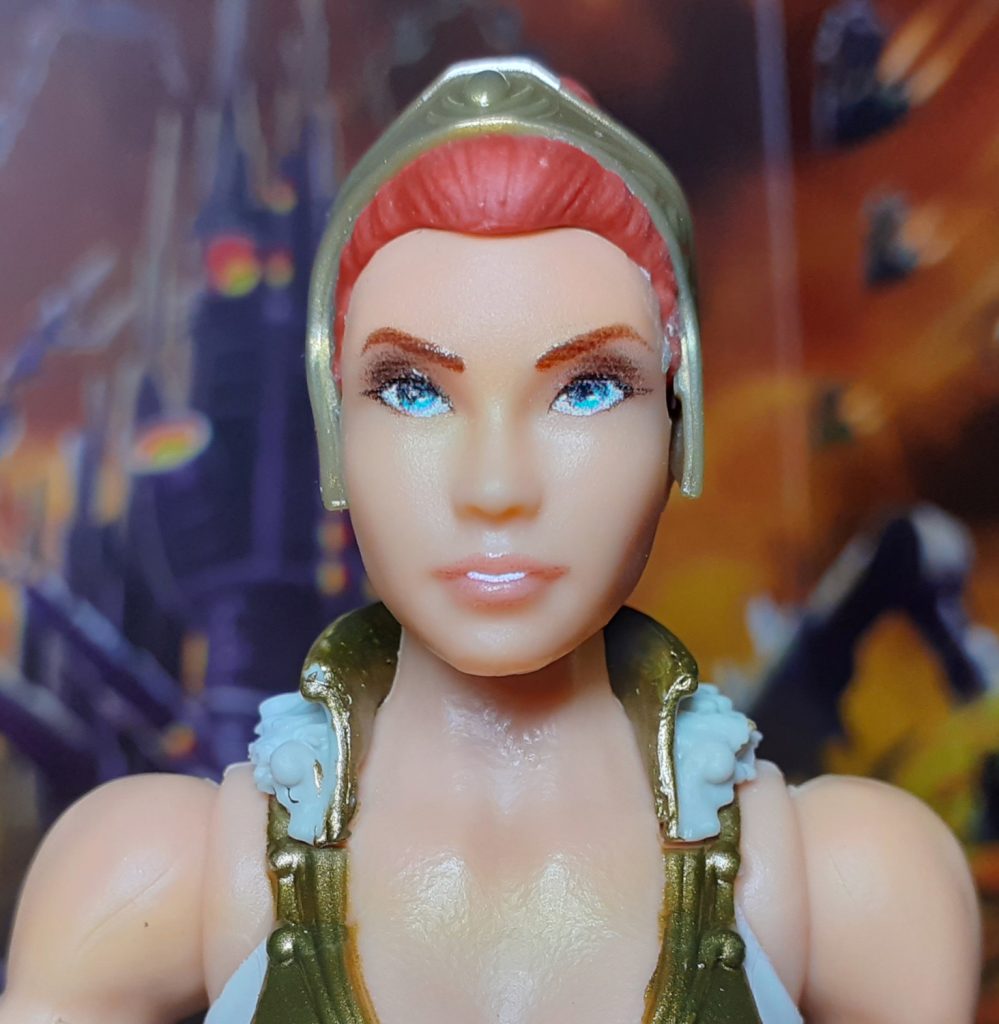 The alternative head for the Vintage Collection Teela figure. This also has red hair held up and back by a gold tiara.