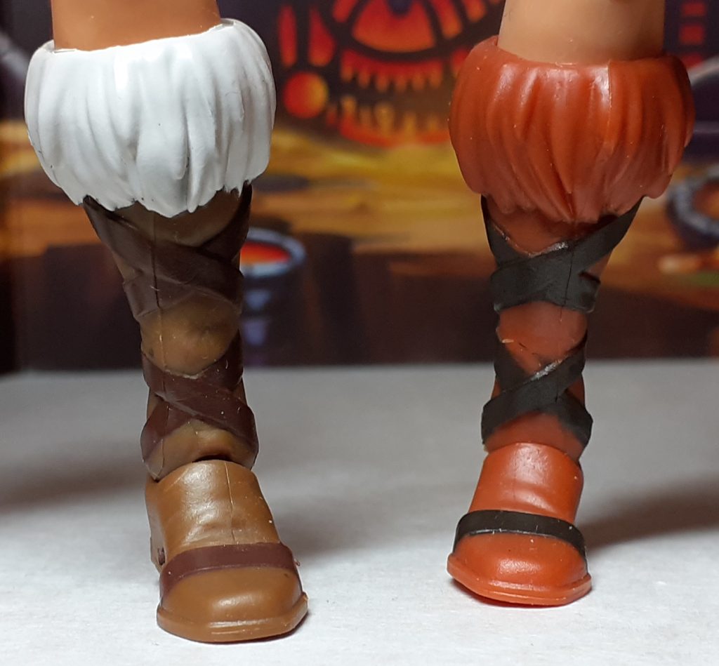 A close up photo of the boots of the two Teela figures. The New Eternia version is on the left while the Vintage Collection one is on the right. Once again, both are exactly the same moulds but the Vintage Collection version uses a brighter brown colour for the boots and leaves the furry boot top unpainted. This latter detail is painted white on the New Eternia figure.