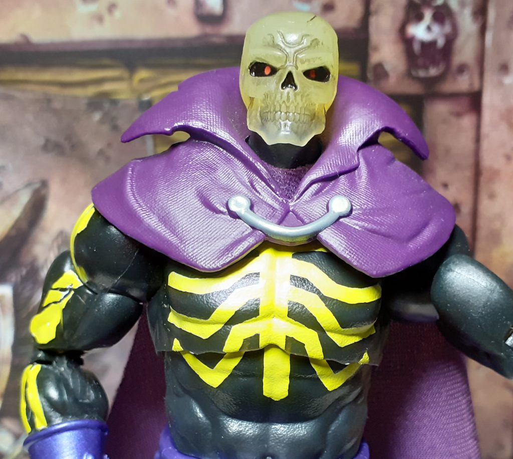 A photo of the Scare Glow figure's upper half. This shows the ribs and back bone which are painted on the torso of the figure. The "bones" are painted in a yellowish bone color.