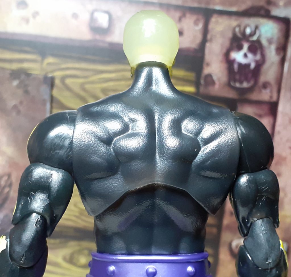 A look at Scare Glow's back. This doesn't have any painted on details at all and is just simply the black plastic the torso is moulded from.