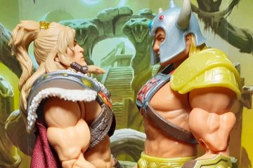 The King Grayskull and Viking He-Man figures standing and facing each other as though they are having a stare off. The King Grayskull figure - on the left - is having to look up a bit in order to look Viking He-Man in the eyes.