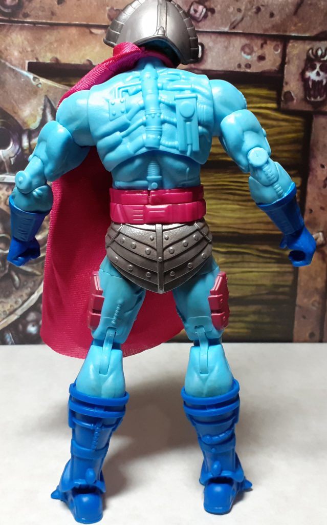 The back of the New Adventures Skeletor figure with the cape lifted out of the way. The back of the figure has lots of cybernetic details such as armoured elbows on the backs of the arms. The spine has a robotic look to it with rib like parts extending out of it.