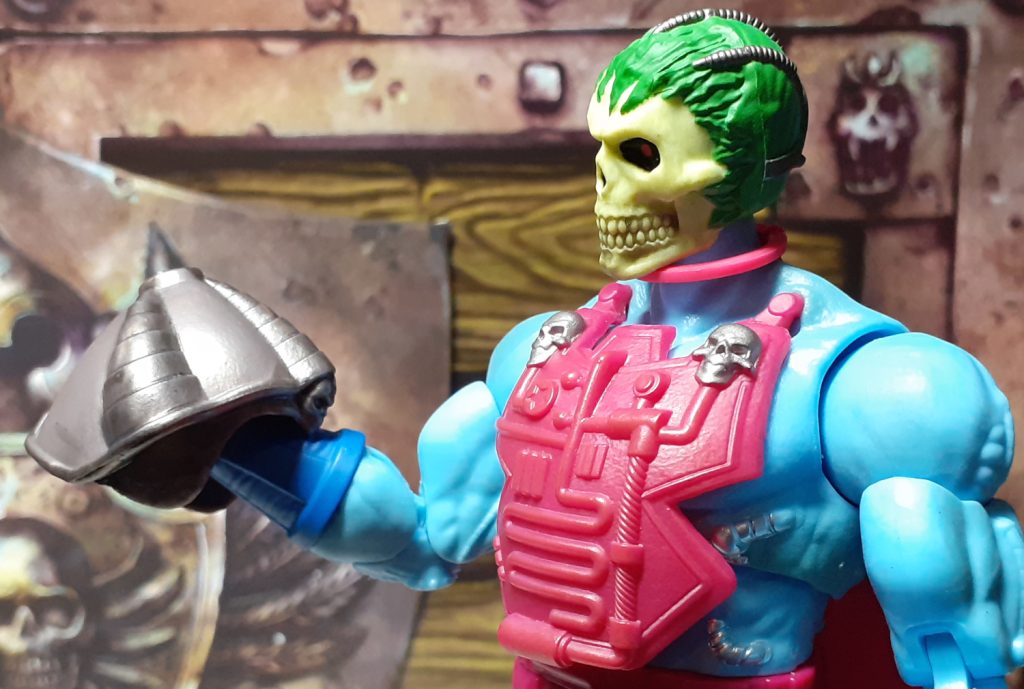The Skeletor figure is off slightly to the right of this photo, looking down to the helmet it is holding in its right hand.