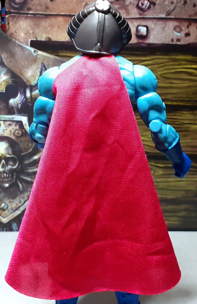 The Skeletor figure from the back with the cape folder over on itself, making it look smaller than it really is.