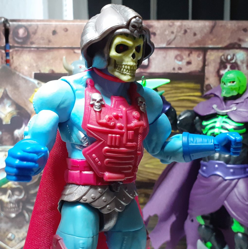 In this photo, the New Adventures Skeletor figure has been bent forwards at the mid-torso. The figure is holding its hands out at the sides as though it is preparing to jump.