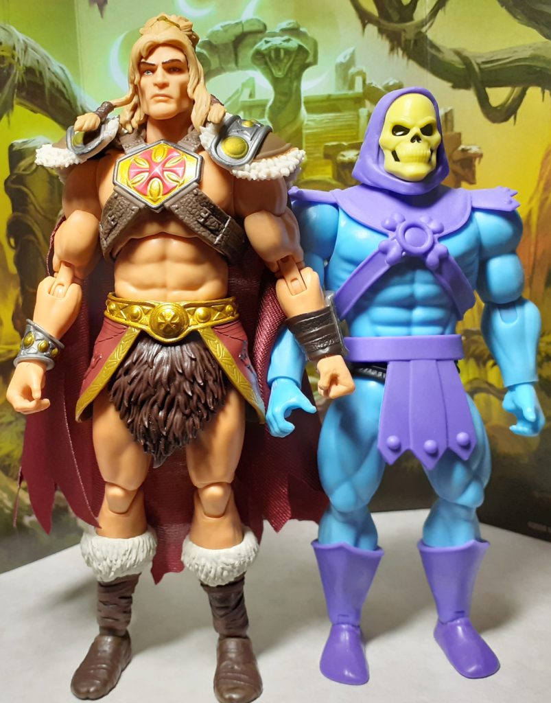 A side by side height comparison photo of the King Grayskull and Cartoon Collection Skeletor figures. On the left of the photo is King Grayskull while on the right is Skeletor.